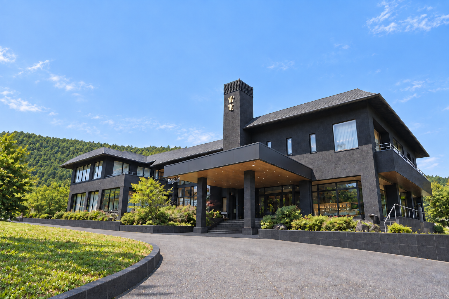 Raiden Resort exterior in summer beneath a clear blue sky